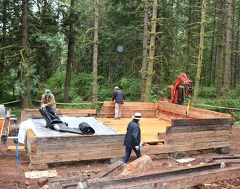 The Molalla Log House is being reassembled near a walking trail by newly constructed ponds  t Hopkins Demonstration Forest.