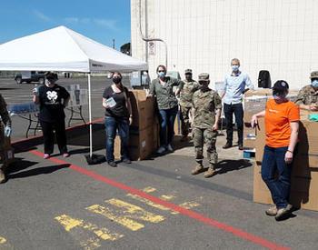 Marion County Extension, Oregon Army National Guard, and ODA Director Alexis Taylor pose for a group shot at the personal protective equipment distribution..