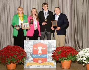 Clancey Krahn (from left), Peyton Rawe, Logan Lancaster and Jim Krahn pose with their awards at the 2023 National 4-H Dairy Cattle Judging Contest.