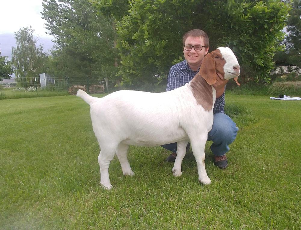 Kalon Shelden poses with his Boer goat.