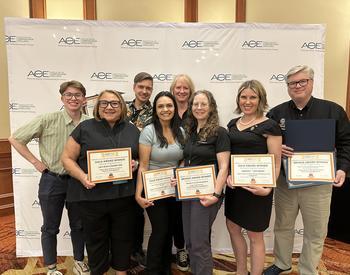 Members of the OSU Extension Communications office Henry Carnell (from left), LeAnn Locher, Alan Dennis, Diana Reyes, Ann Marie Murphy, Janet Donnelly and Jennifer Alexander pose with awards at the ACE Conference in Salt Lake City.