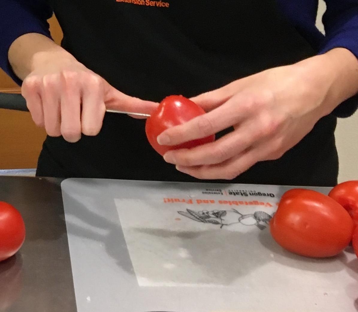 Demonstration of removing cores from tomatoes