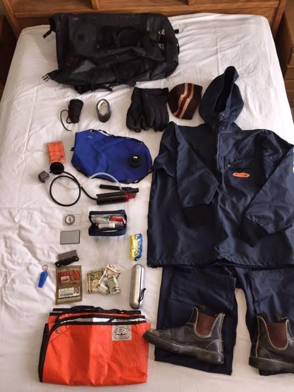 Tarp, rain gear, first aid items, hat, backpack, water filter
