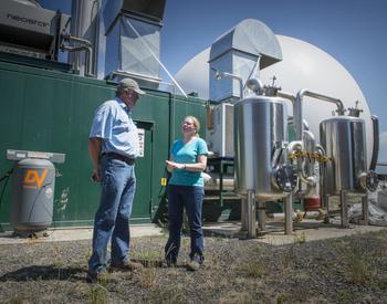 OSU Extension Dairy Management faculty Jenifer Cruickshank touring the methane-powered generating plant at Forest Glen Oaks Dairy with dairyman Dan Bansen.