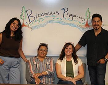 Promotora program participants at welcome table