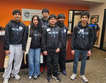 High Voltage 4-H Robotics team posing at an OSU Extension office